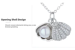 Macro view of foldable shell pendant with micro-pave zircons and white pearl inlay