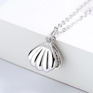Minimalist S925 sterling silver seashell necklace with polished pearl pendant details