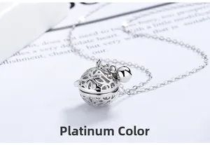 Macro shot of silver hollow-out flower bell pendant with polished metallic finish