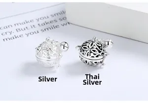 Macro detail of S925 sterling silver hollow bell pendants in silver and antique finishes