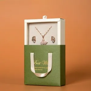 Elegant jewelry gift set with swan necklace and D earrings in a matte green drawer box