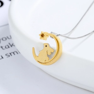 925 silver necklace with two-tone moon and rabbit pendant on white ceramic edge