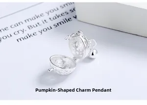 Detailed S925 sterling silver hollow bell pendant with a gourd clasp on white desk