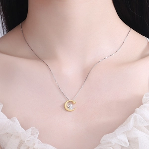 Elegant 925 sterling silver moon and rabbit pendant necklace worn on a model's neck