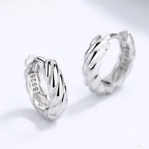 Macro view of S925 sterling silver hoop earrings with twisted rope texture and hallmark