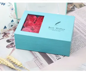 Teal rectangular rose gift box with red soap flowers and Best Wishes feather design
