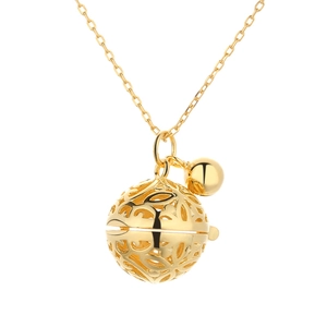 Exquisite gold harmony ball pendant necklace with floral cutout design on white background