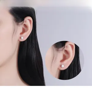Close-up of S925 sterling silver screw-back stud earrings with six-prong set cubic zirconia