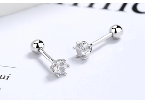 Macro shot of 925 silver six-prong stud earrings with clear zircon and screw back