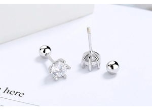 Detail showing the six-prong setting and screw-back closure on round zircon silver studs