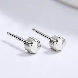 Minimalist S925 sterling silver stud earrings with cylindrical pointed design on white background