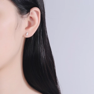 Minimalist S925 silver stud earring with rectangular zircon on model side profile