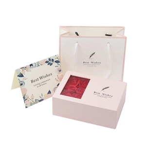 Pink preserved rose gift box set with matching white carry bag and floral greeting card