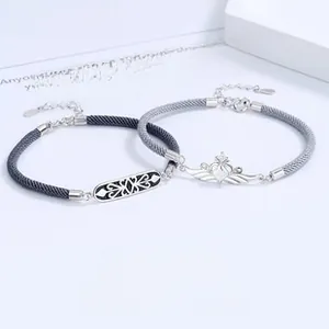 Detail view of Mobius 925 sterling silver couple bracelets with crown and knight charms