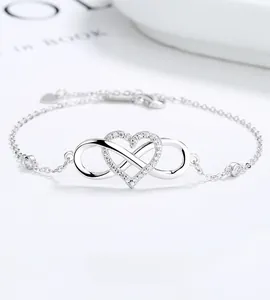 Macro view of 925 silver infinity heart bracelet with shimmering cubic zirconia