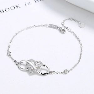 925 sterling silver infinity heart bracelet with cubic zirconia on white background