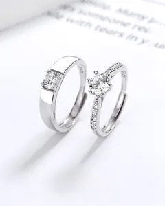 Close-up of S925 sterling silver couple rings set with six-prong zircon and inner hallmark