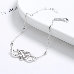 925 sterling silver infinity heart bracelet with cubic zirconia on white tray