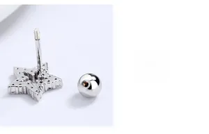 Macro shot of silver star stud earring with threaded screw back and pavé crystals