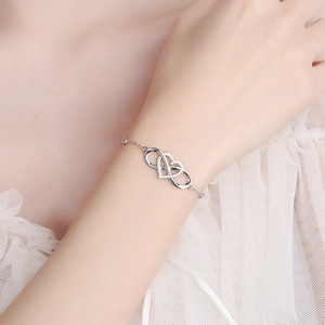 925 sterling silver infinity heart bracelet with cubic zirconia on female wrist