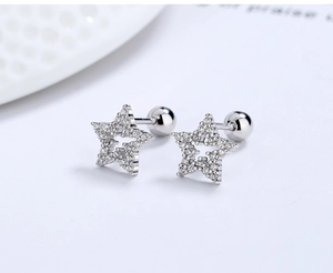 Macro view of S925 sterling silver star earrings with pavé cubic zirconia and screw backs