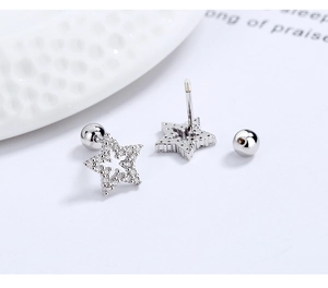 Detail of s925 silver star stud earrings with hollow design and zircon screw back