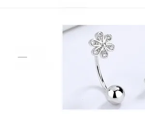 Detailed macro view of S925 sterling silver navel ring with zircon six-petal flower design