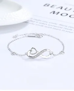 Detail view of 925 silver infinity heart bracelet with cubic zirconia and adjustment chain