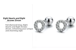 Detail of S925 silver hoop earrings with pavé set hearts and arrows zircon and screw back