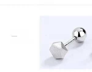 Detailed view of S925 sterling silver hexagon stud earrings with brushed metal texture