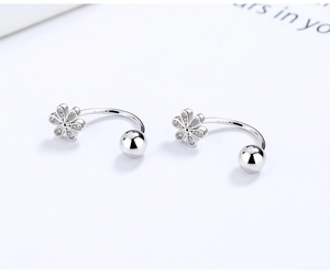 Close-up of S925 sterling silver U-shaped earring with zircon flower and screw-on ball back
