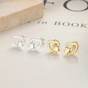 Detailed view of gold and silver heart and star stud earrings with screw ball backs