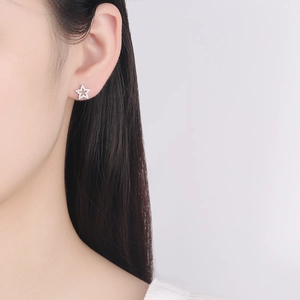 Sparkling S925 sterling silver hollow star stud earrings with white zircon for women