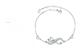 Macro detail of S925 sterling silver infinity heart bracelet with sparkling zircon stones
