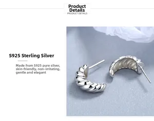 Detail view of S925 sterling silver twisted croissant hoop earrings with polished finish
