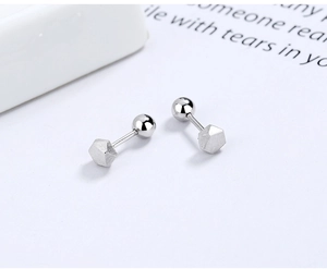 Detailed view of S925 sterling silver hexagonal stud earrings with matte brushed finish
