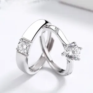 Macro view of S925 sterling silver couple rings with cubic zirconia and adjustable band