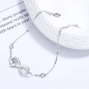 925 sterling silver infinity heart bracelet with cubic zirconia on white ceramic tray