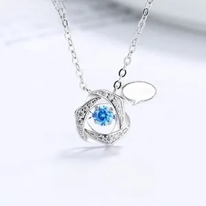 Macro shot of S925 silver heart necklace featuring a blue moving zircon stone pendant