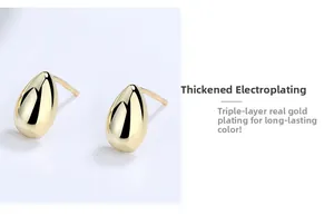 Macro detail of gold teardrop earrings showing triple-layer plating for long-lasting color