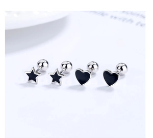 Detail of S925 silver star and heart stud earrings with black enamel and screw backs
