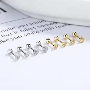Macro shot of 925 silver heart screw back studs with gold and silver plated finishes
