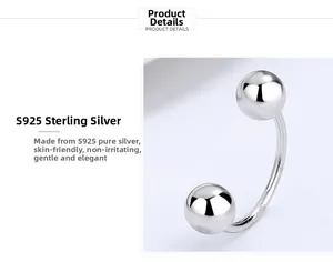Macro detail of S925 sterling silver U-shaped screw earrings with polished ball ends