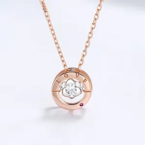 Detail of rose gold necklace with LOVE engraving and central silver flower pendant