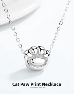 Macro shot of polished S925 sterling silver cat footprint pendant with sleek O-chain