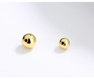 Macro shot of 925 silver screw back ear nuts in gold polished finish for jewelry DIY