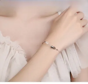 Detailed view of an S925 sterling silver geometric bracelet worn on a woman's wrist