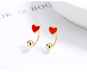 Detailed view of red enamel heart earring showing S925 sterling silver hallmark