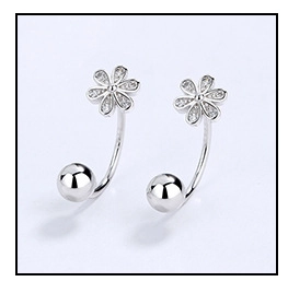 Macro detail of S925 silver flower stud earring with sparkling pavé cubic zirconia