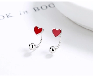 Macro shot of 925 sterling silver red enamel heart stud earring with screw back